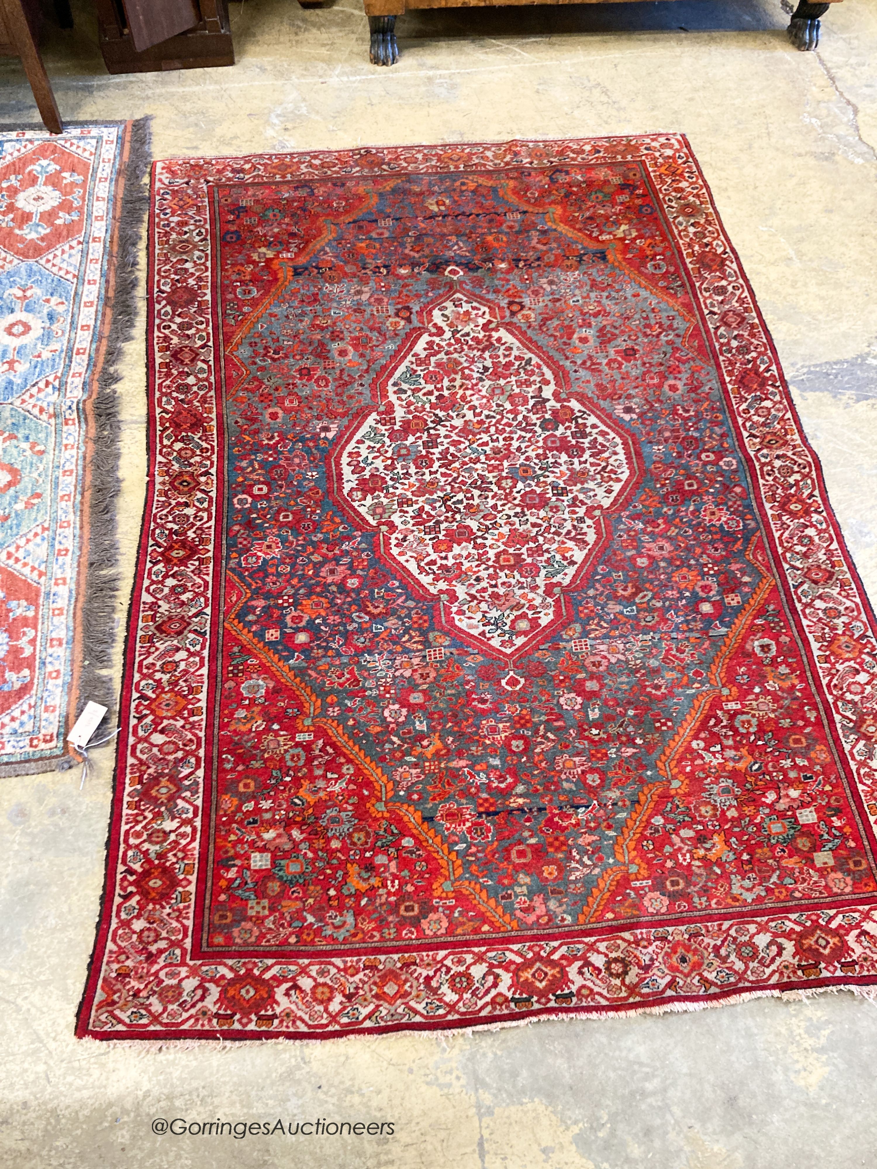 A North West Persain red ground rug, 200 x 132cm